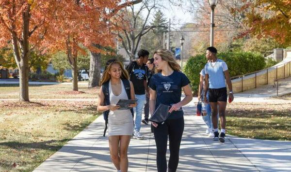 凯发 students walking in autumn on the Fayette campus